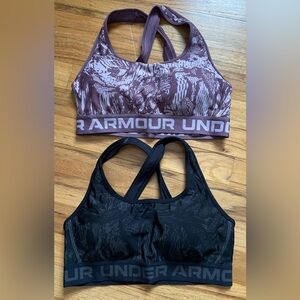 Under Armour sports bras, set of 2. Black and mauve. Size medium.